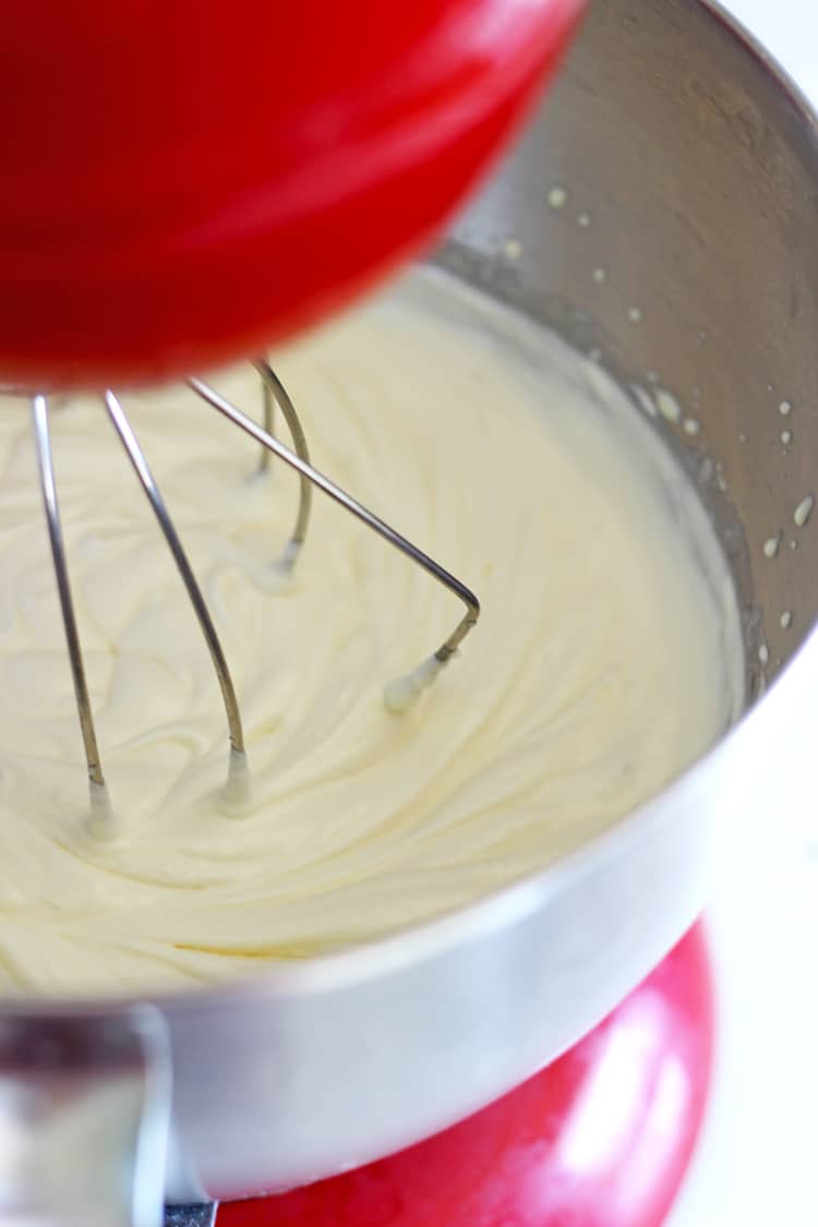 Stand mixer with whisk attachment whipping cream