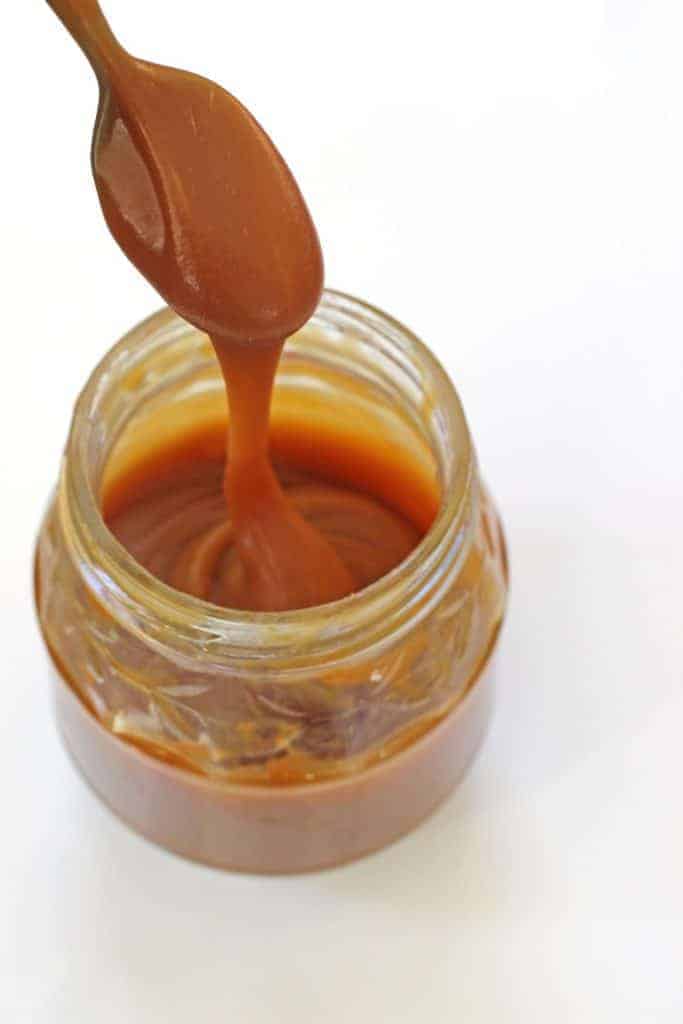 Sweet, salty, pure delicious. Homemade Salted Caramel Sauce that uses only 4 ingredients and is ready in 10 minutes! Perfect for cupcakes, ice-cream or milkshakes! | thekiwicountrygirl.com