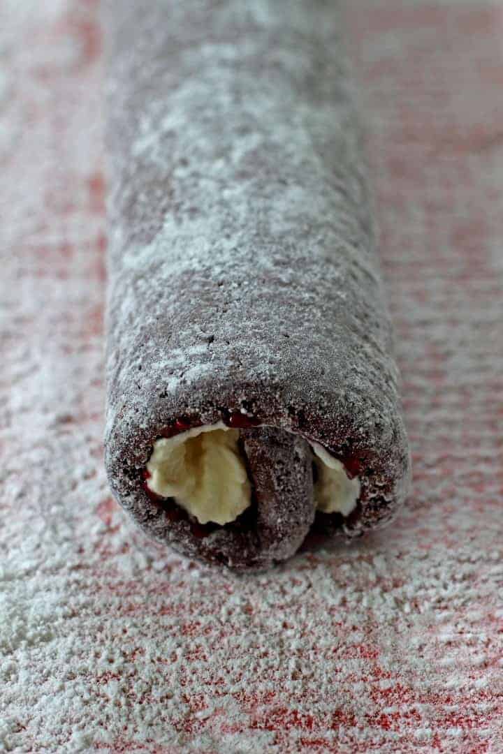 A silent chocolate sponge cake roll, stuffed with whipped cream and jam, and covered in chocolate icing!  Chocolate Cake Roll Chocolate Cake Roll 6