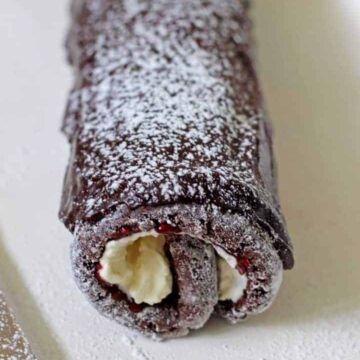A silent chocolate sponge cake roll, stuffed with whipped cream and jam, and covered in chocolate icing!  Chocolate Cake Roll Chocolate Cake Roll 7 360x360