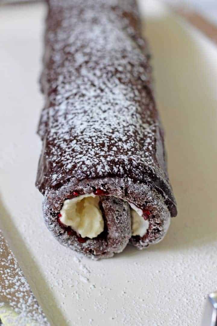 A silent chocolate sponge cake roll, stuffed with whipped cream and jam, and covered in chocolate icing!  Chocolate Cake Roll Chocolate Cake Roll 7