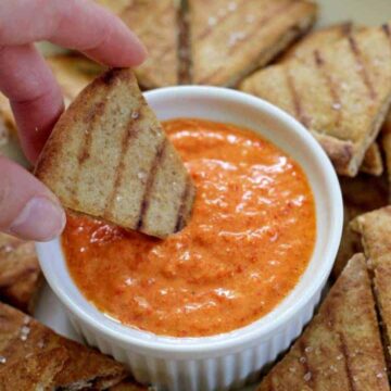 Roasted red pepper & feta dip....throw it together in 5 minutes and serve with super quick & easy pita chips!
