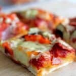 Thick and chewy pizza bread made with homemade pizza dough and all your favourite toppings!