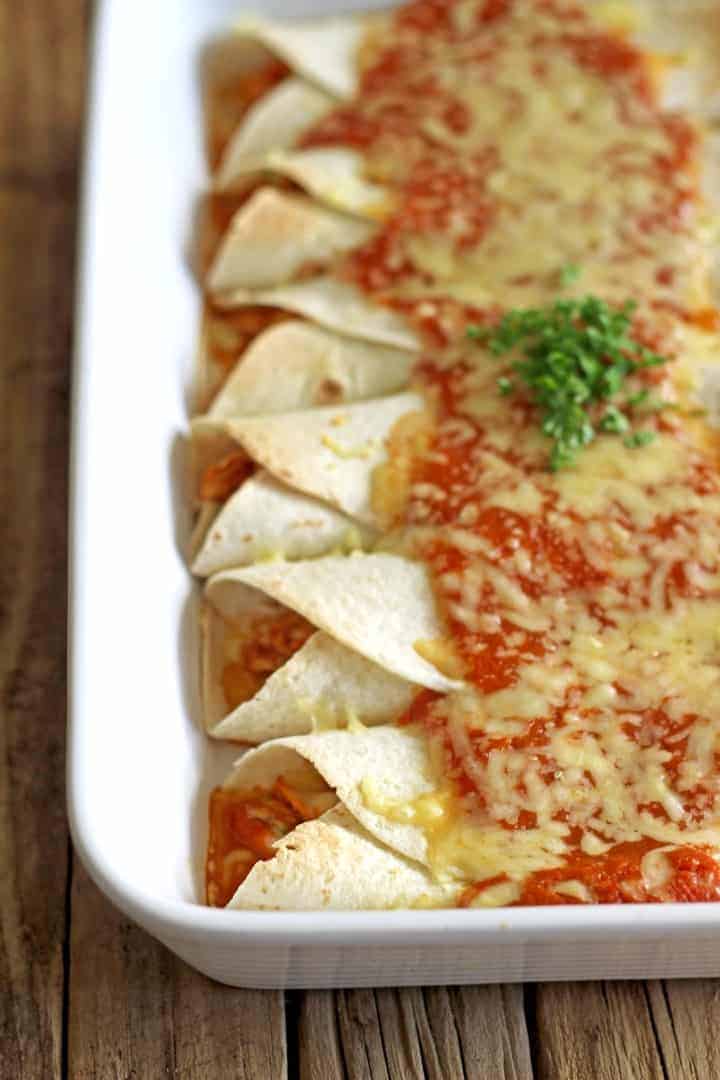Slow Cooker Chicken Enchiladas with homemade enchilada sauce - the perfect fuss free, delicious Mexican dinner!