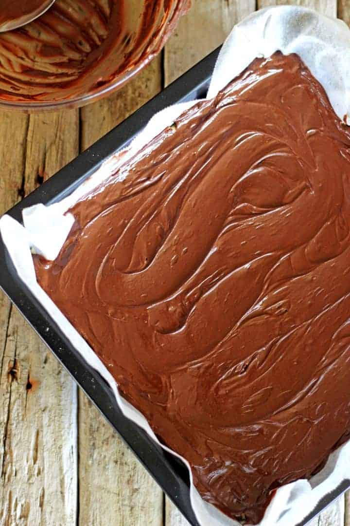 Triple layer chocolate caramel slice - coconut base, gooey caramel filling & dark chocolate topping
