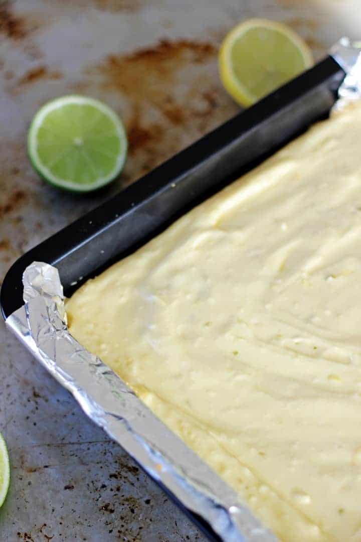 Key lime pie cheesecake bars inspired by actual key lime pie - the're the perfect combination of sweet, tangy, summery & delicious! | Recipe at thekiwicountrygirl.com