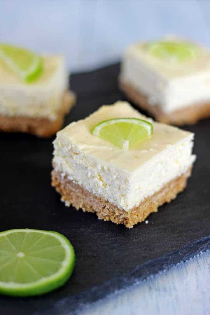 Key lime pie cheesecake bars inspired by actual key lime pie - the're the perfect combination of sweet, tangy, summery & delicious! | Recipe at thekiwicountrygirl.com