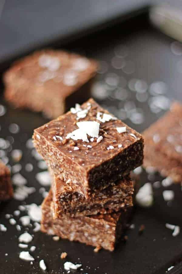 This chocolate coconut slice is a family favourite in our house. It has a chocolate & coconut base and topping, it's easy to make and only takes 30 minutes | thekiwicountrygirl.com