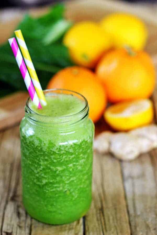 Beat the winter ills & chills with this cold fighting citrus green smoothie - oranges, lemon, ginger, pineapple & spinach make a delicious healthy smoothie | thekiwicountrygirl.com