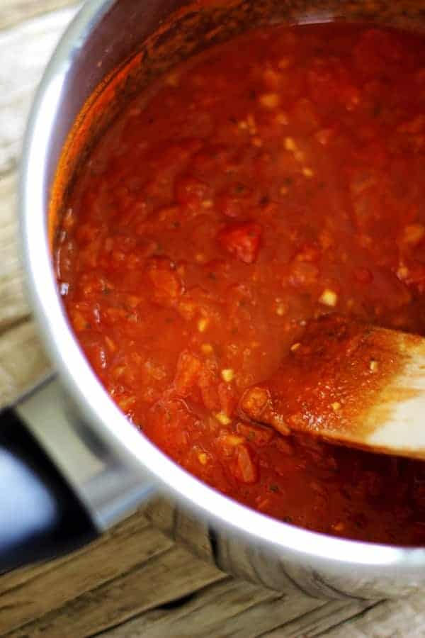 Homemade marinara sauce - the easiest way to make dinner on a Sunday. Throw the ingredients in a pot and simmer away. Simple, delicious & versatile! | thekiwicountrygirl.com