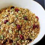 Sweet, spicy and full of extra goodies this Pumpkin Spice Granola is autumn in a bowl! | thekiwicountrygirl.com