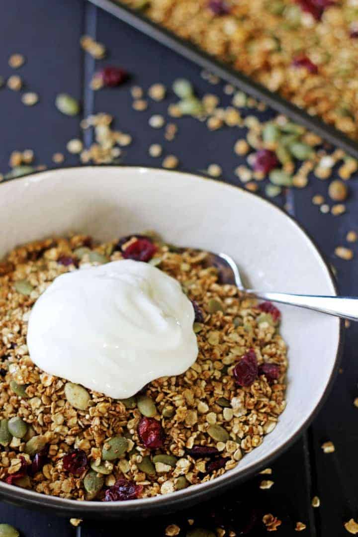 Sweet, spicy and full of extra goodies this Pumpkin Spice Granola is autumn in a bowl! | thekiwicountrygirl.com