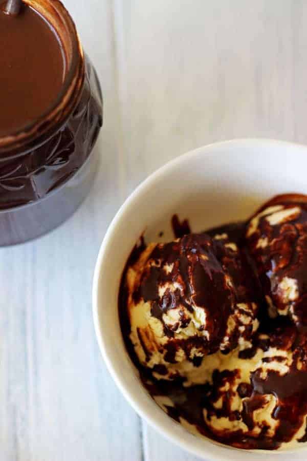 Homemade hot fudge sauce - the perfect thing to feed your ice-cream addiction, even in the middle of winter! Made from ingredients you have in your pantry! | thekiwicountrygirl.com