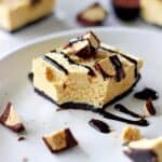 My all time favourite, easy to make dessert - no bake peanut butter cup cheesecake bars. The perfect make ahead dessert for anyone who loves peanut butter! | thekiwicountrygirl.com