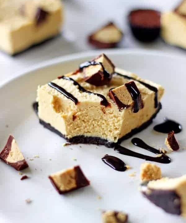 My all time favourite, easy to make dessert - no bake peanut butter cup cheesecake bars. The perfect make ahead dessert for anyone who loves peanut butter! | thekiwicountrygirl.com