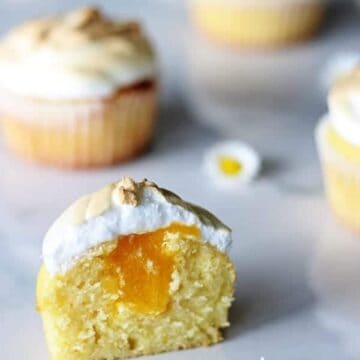 Lemon Meringue Cupcakes - light lemon cupcakes, filled with lemon curd & topped with meringue. They're the perfect spring dessert | thekiwicountrygirl.com