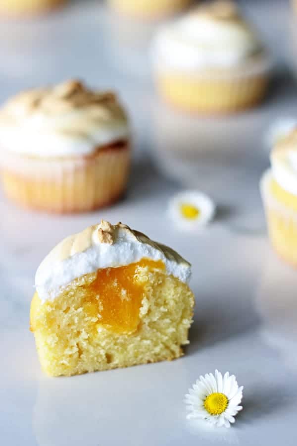 Lemon Meringue Cupcakes - light lemon cupcakes, filled with lemon curd & topped with meringue. They're the perfect spring dessert | thekiwicountrygirl.com