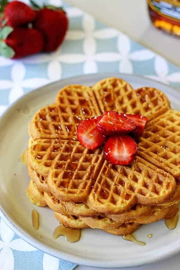 How all Sunday mornings should be spent - lazy starts, coffee and the best buttermilk waffles covered in maple syrup and fresh summer strawberries! | thekiwicountrygirl.com