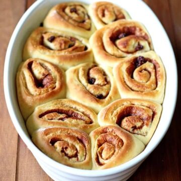 The perfect breakfast for Christmas morning - or any other time of year - soft, fluffy and sticky homemade cinnamon rolls with maple glaze! | thekiwicountrygirl.com