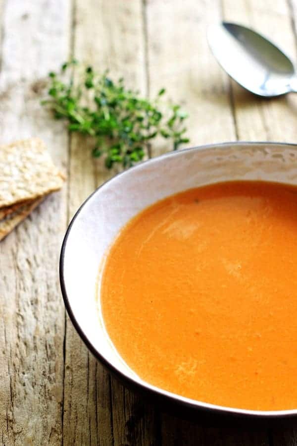 Homemade tomato soup - the ultimate in pre-holiday comfort food. Quick, easy and so satisfying. Perfect for lunch served with grilled cheese! | thekiwicountrygirl.com