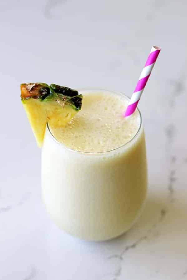 The best way to start getting excited for summer is with a pina colada smoothie - it's your favourite cocktail in healthy smoothie form! | thekiwicountrygirl.com