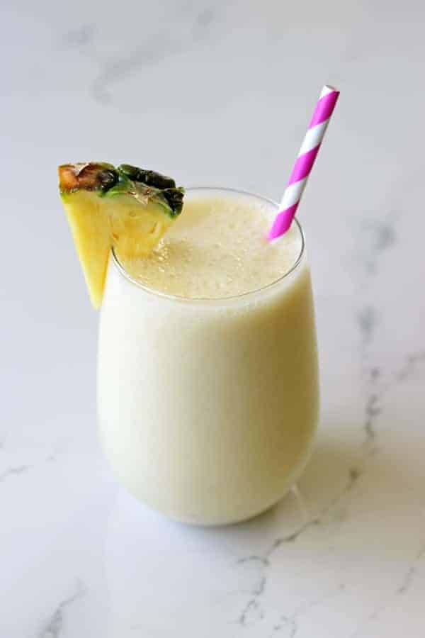 The best way to start getting excited for summer is with a pina colada smoothie - it's your favourite cocktail in healthy smoothie form! | thekiwicountrygirl.com