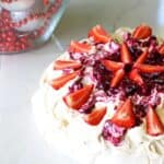 A Kiwi Christmas classic - this easy homemade pavlova will make you never want to buy one again! Covered in fresh summer berries it's the perfect dessert | thekiwicountrygirl.com