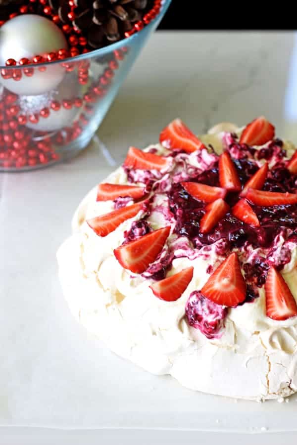 A Kiwi Christmas classic - this easy homemade pavlova will make you never want to buy one again! Covered in fresh summer berries it's the perfect dessert | thekiwicountrygirl.com