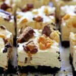 No Bake Snickers Cheesecake Bars - a new flavour of our favourite dessert, easy no bake cheesecake bars. Caramel, peanuts & cheesecake...dessert perfection! | thekiwicountrygirl.com