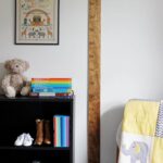 Toddler bedroom with bookshelf and DIY ruler growth chart on wall