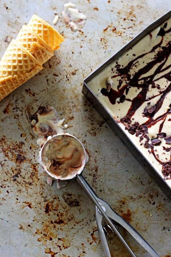 The best no churn peanut butter ice cream with chocolate. Quick, easy no churn peanut butter ice cream with dark chocolate chunks & a chocolate swirl! | thekiwicountrygirl.com