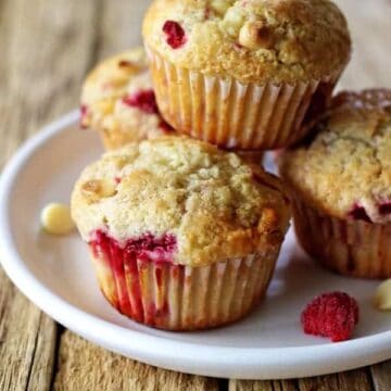 Raspberry & white chocolate muffins - my favourite quick & easy muffin recipe with delicious raspberries & white chocolate in every bite! | thekiwicountrygirl.com