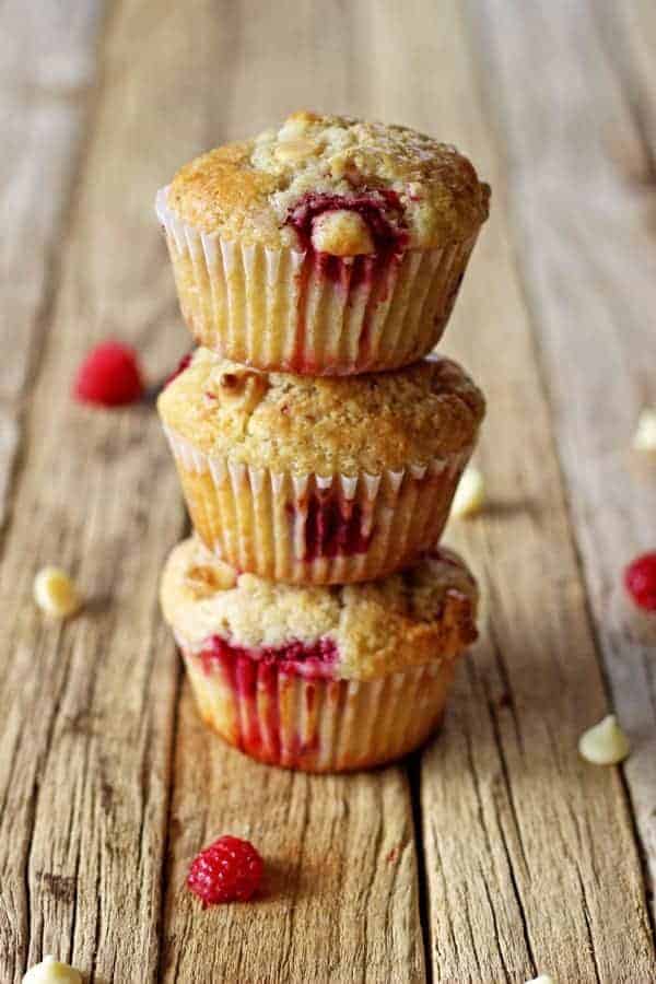 Raspberry & white chocolate muffins - my favourite quick & easy muffin recipe with delicious raspberries & white chocolate in every bite! | thekiwicountrygirl.com