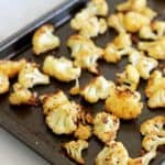 Parmesan Roasted Cauliflower - the perfect way to eat this delicious vegetable, cheesy, crispy and a great snack or side dish! | thekiwicountrygirl.com