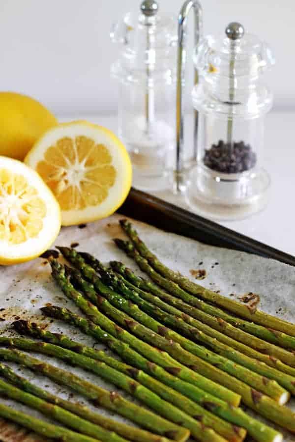 Lemon roasted asparagus - the perfect quick & easy side dish for early summer BBQ's. Ready in 20 minutes it's fresh, lemony and tastes like spring! | thekiwicountrygirl.com