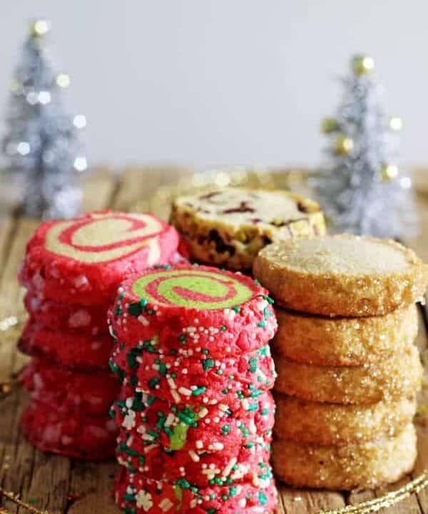 1 basic dough = 4 slice and bake Christmas cookie recipes! Christmas pinwheels, candy cane pinwheels, Christmas Spice, Orange, Cranberry & Pistachio! | thekiwicountrygirl.com