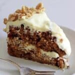 My all time favourite Carrot Cake recipe - loaded with grated carrot, crushed pineapple and crunchy walnuts and smothered in cream cheese frosting, this will become your favourite carrot cake recipe too! | thekiwicountrygirl.com