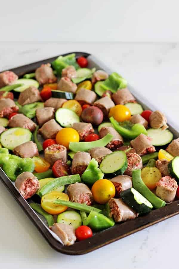 Sheet Pan Sausage & Veggies with Satay Sauce - a quick, easy and super tasty sheet pan dinner with colourful veggies, tasty sausages and a killer satay sauce! Great for weeknights and meal prep | thekiwicountrygirl.com