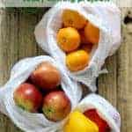 3 white muslin produce bags with fruit & vegetables