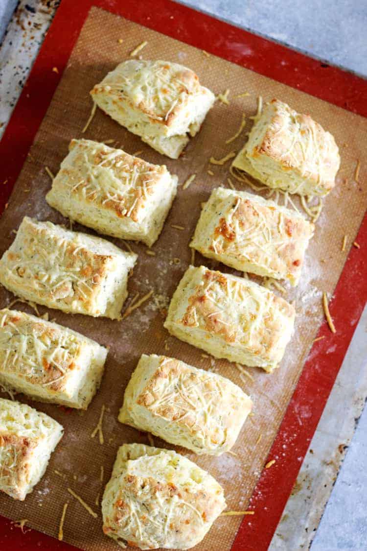 Freshly baked cheese scones on a baking tray