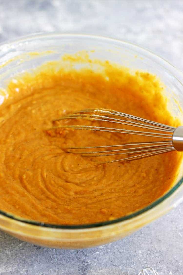 Mixing bowl with ingredients for pumpkin spice bread