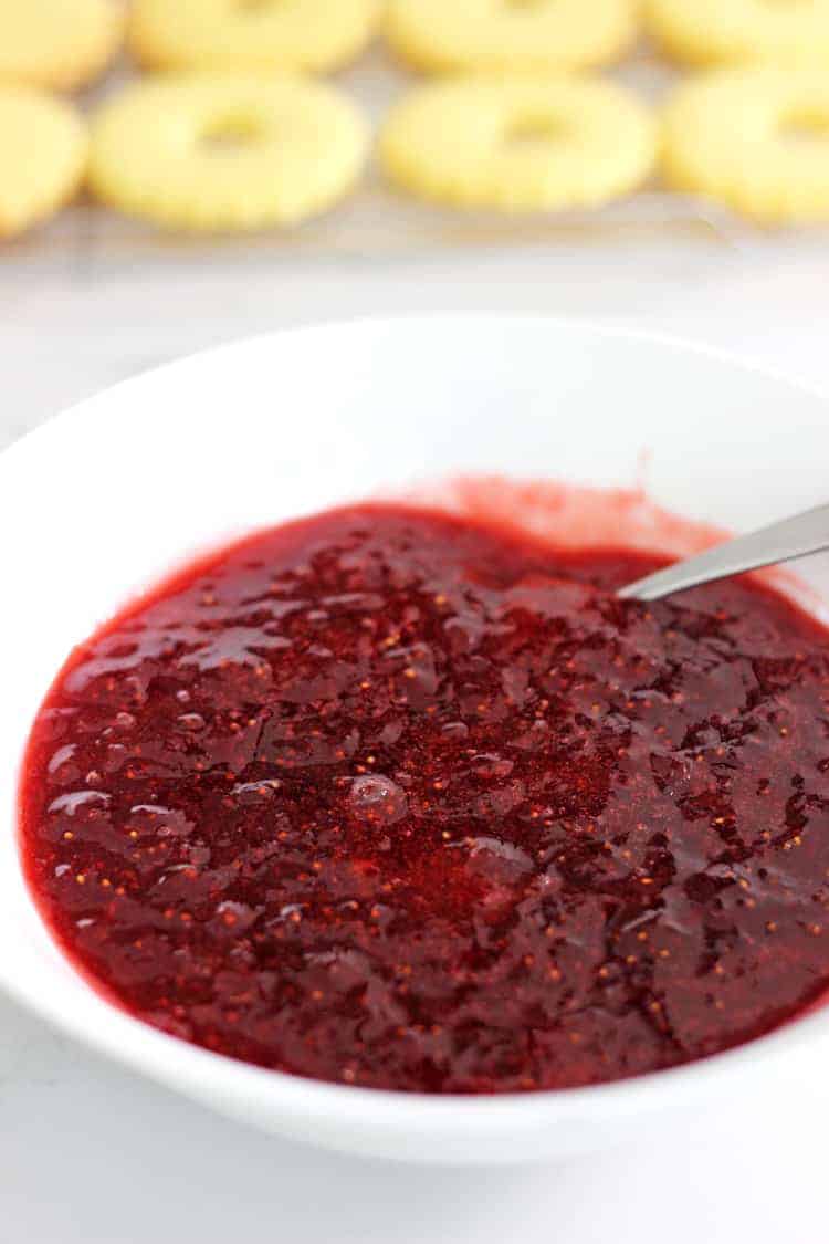 Homemade strawberry jam in a white bowl
