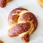 Overhead shot of homemade soft pretzel on white background