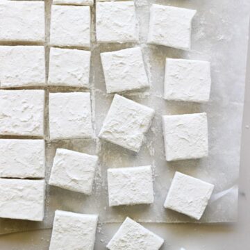Overhead of homemade marshmallows on a white background