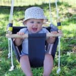 Baby swinging in handmade DIY baby swing