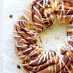 Overhead of cinnamon roll wreath with vanilla glaze