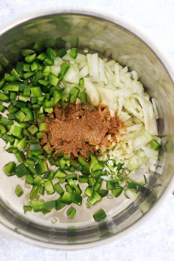 Pot with green pepper, onions and burrito spice mix