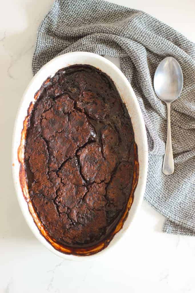 Chocolate self saucing pudding in white dish