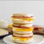 Stack of 3 bacon and egg freezer muffins with text overlay
