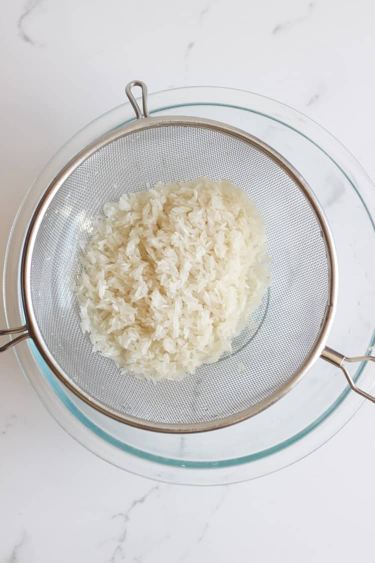 White rice in a sieve